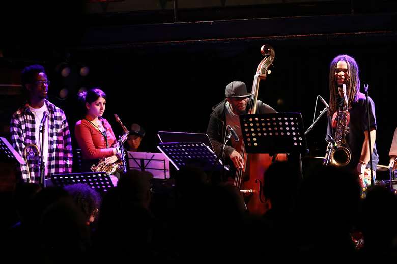 Bassist Daniel Casimir with I AM A WARRIOR musicians - Photo by Funky Feet