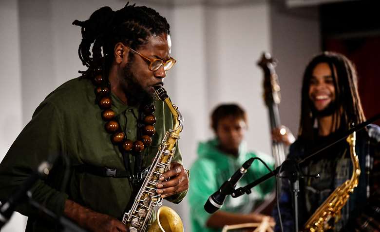 Soweto Kinch performs with Tomorrow's Warriors musicians - Photo by Graeme Miall